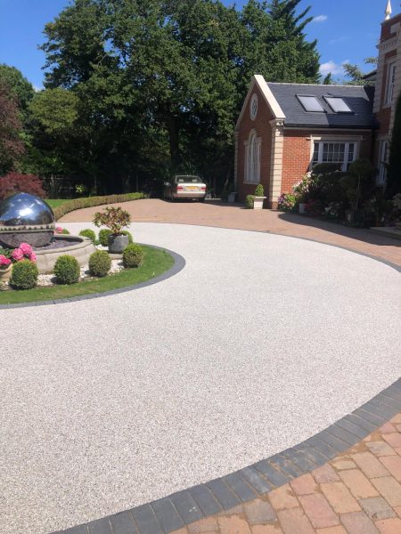 Silver resin driveway with paving border in Edmonton
