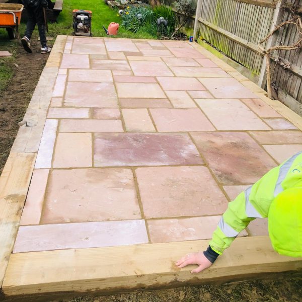 Sandstone patio installation in Abridge