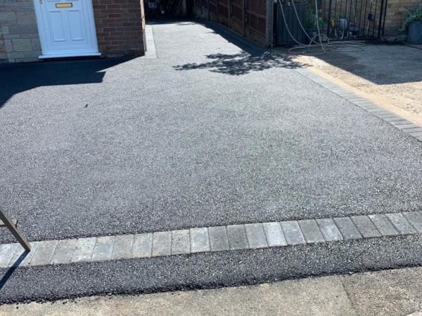 Tarmac with edging kerb border in Chigwell